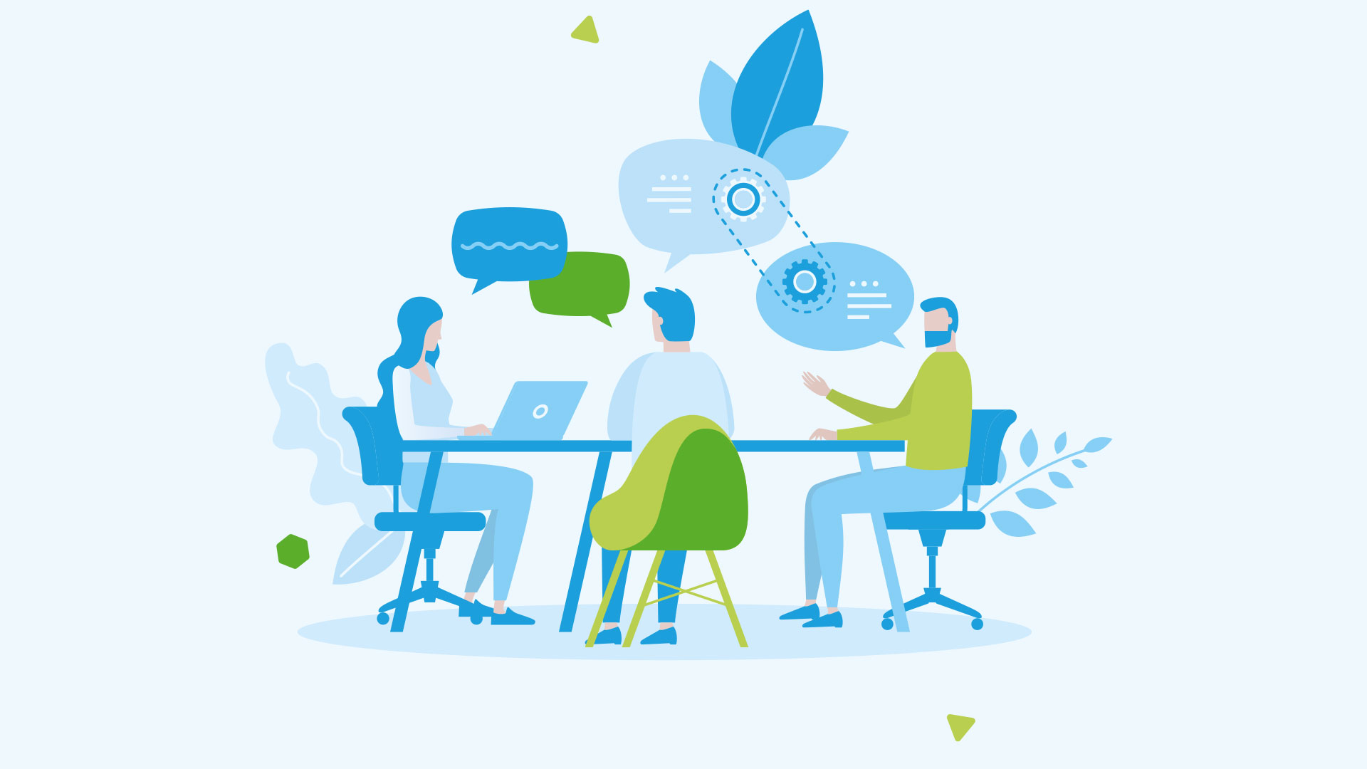 Drei Personen sitzen an einem Tisch und arbeiten mit Laptops.